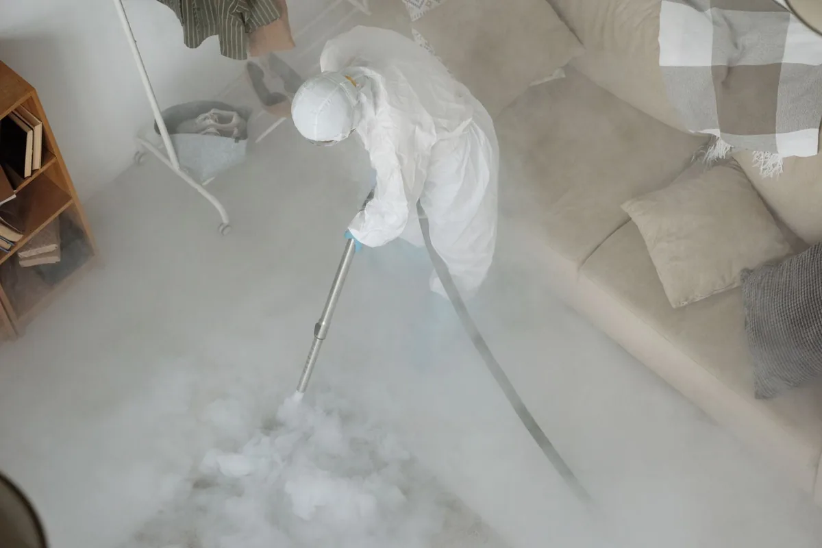 Biohazard cleanup technician in protective equipment, Hatch, NM